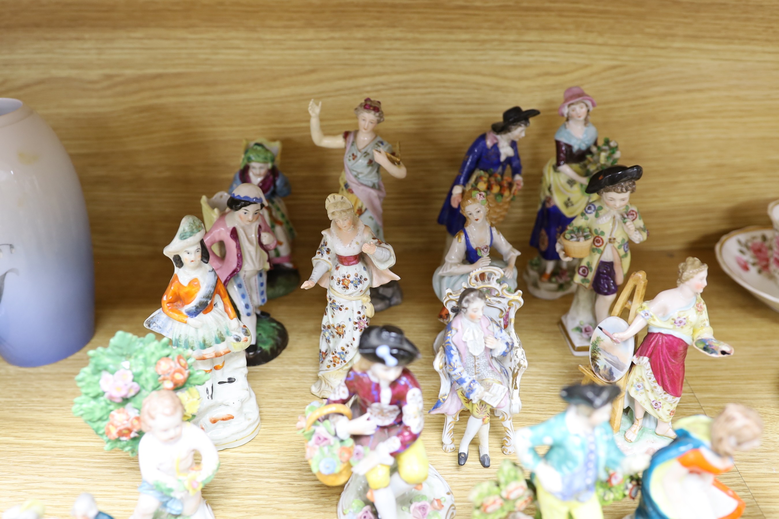 A group of small continental porcelain figures, to include Dresden and others